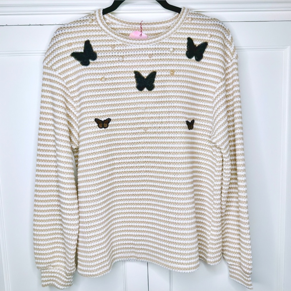 Hand-embellished butterfly sweater with pearl detailing.